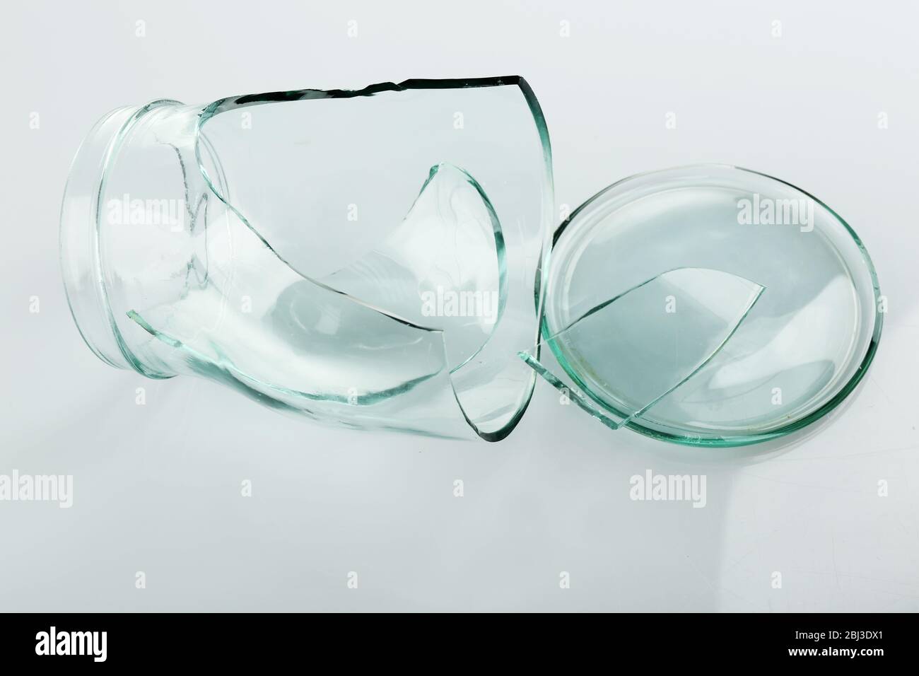 Shattered glass jar isolated on white Stock Photo Alamy