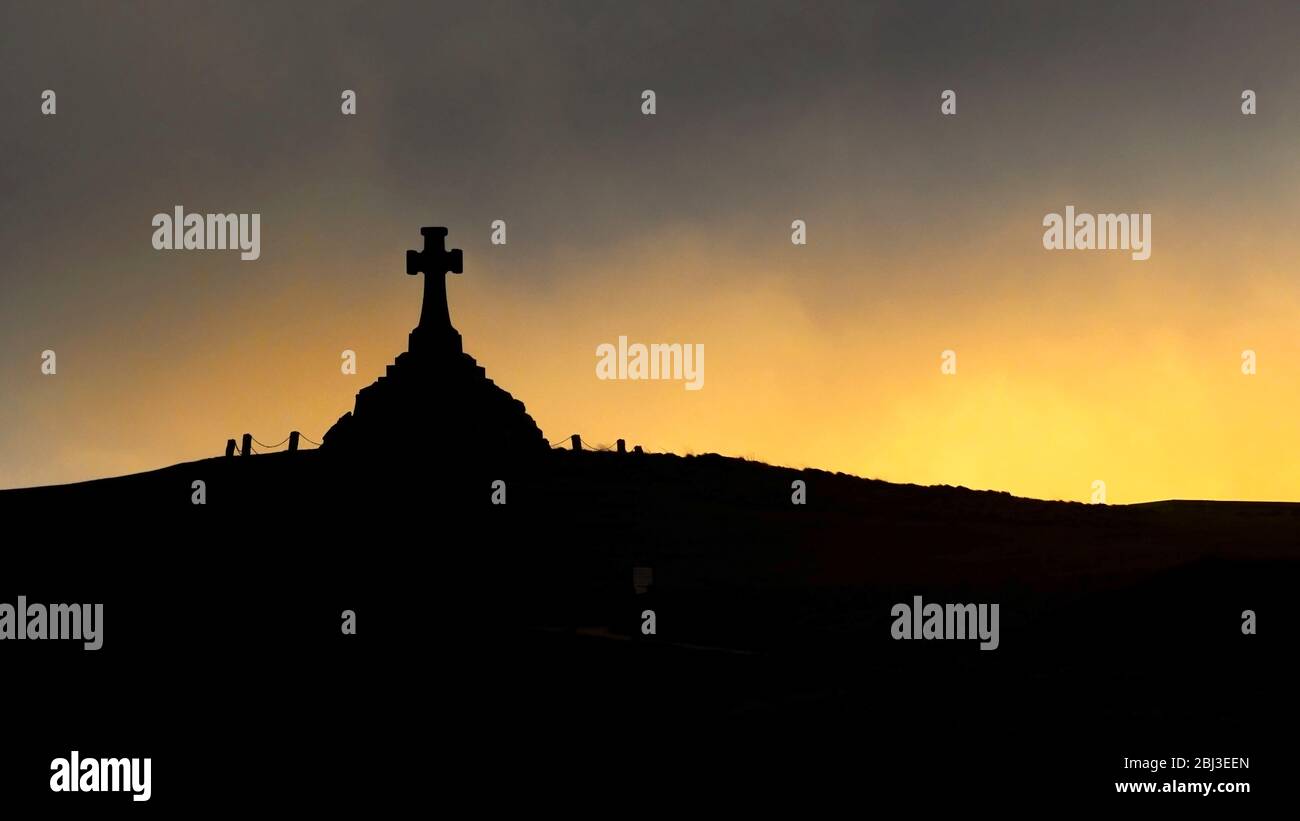 A panorama of the Newquay War Memorial seen in silhouette at sunset in Newquay in Cornwall. Stock Photo