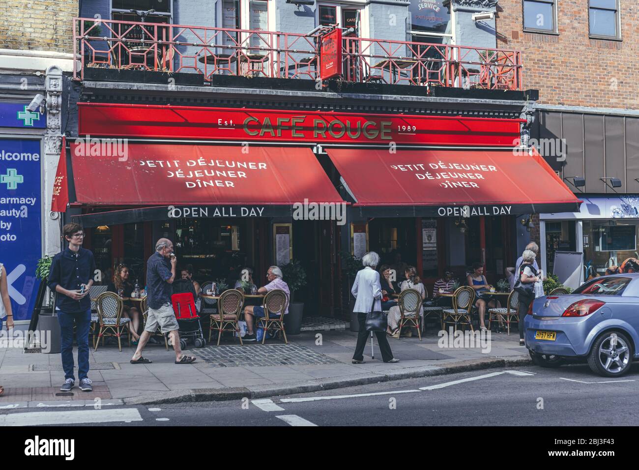 London/UK-1/08/18: people socializing in the outdoor sitting area in Café Rouge on Hampstead High Street, a Parisienne bistro-style cafe Stock Photo