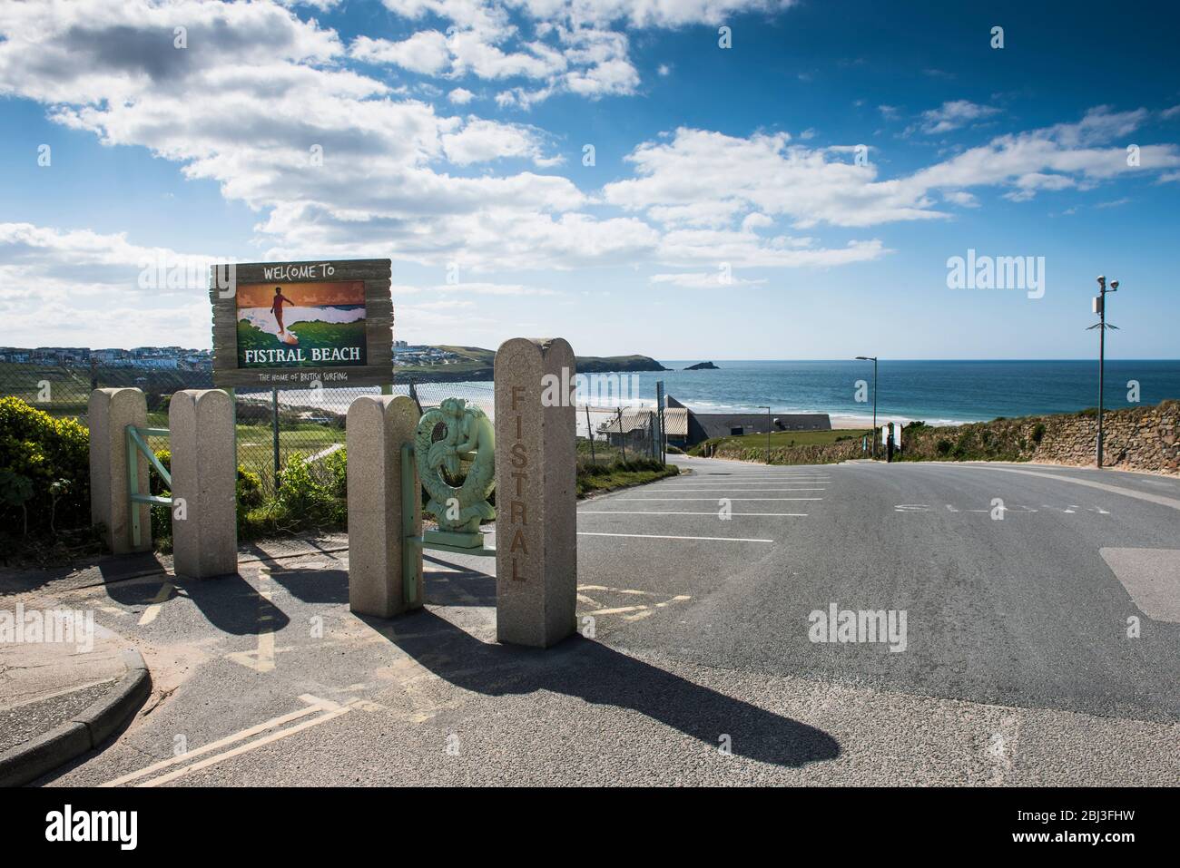 The entrance to the normally busy car park at Fistral in Newquay now completely deserted as a result of the Covid 19 Coronavirus restrictions. Stock Photo