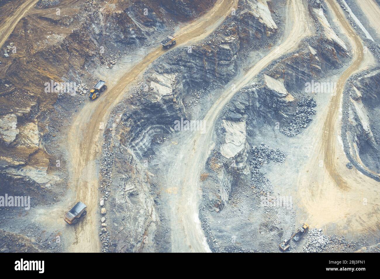 Mining from above. Industrial terraces on open pit  mineral mine. Aerial view of opencast mining. Dolomite Mine Excavation. Extractive industry. Giant Stock Photo
