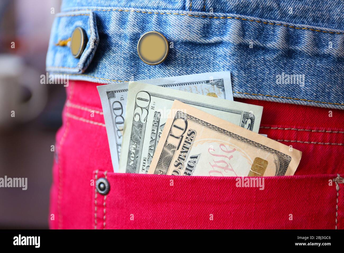 Dollar banknotes in jeans pocket closeup Stock Photo