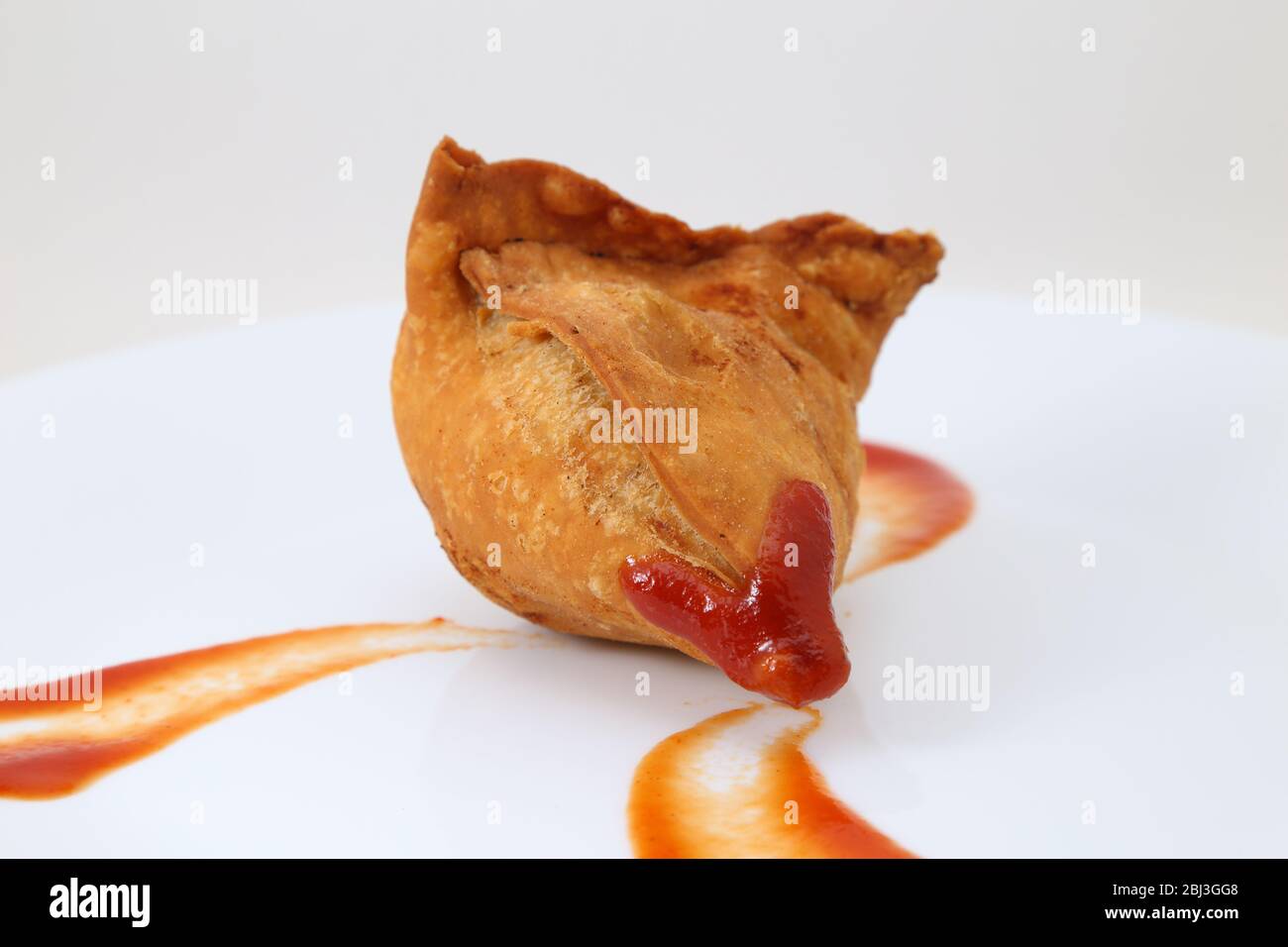 Samosa with sauce with chutney Stock Photo