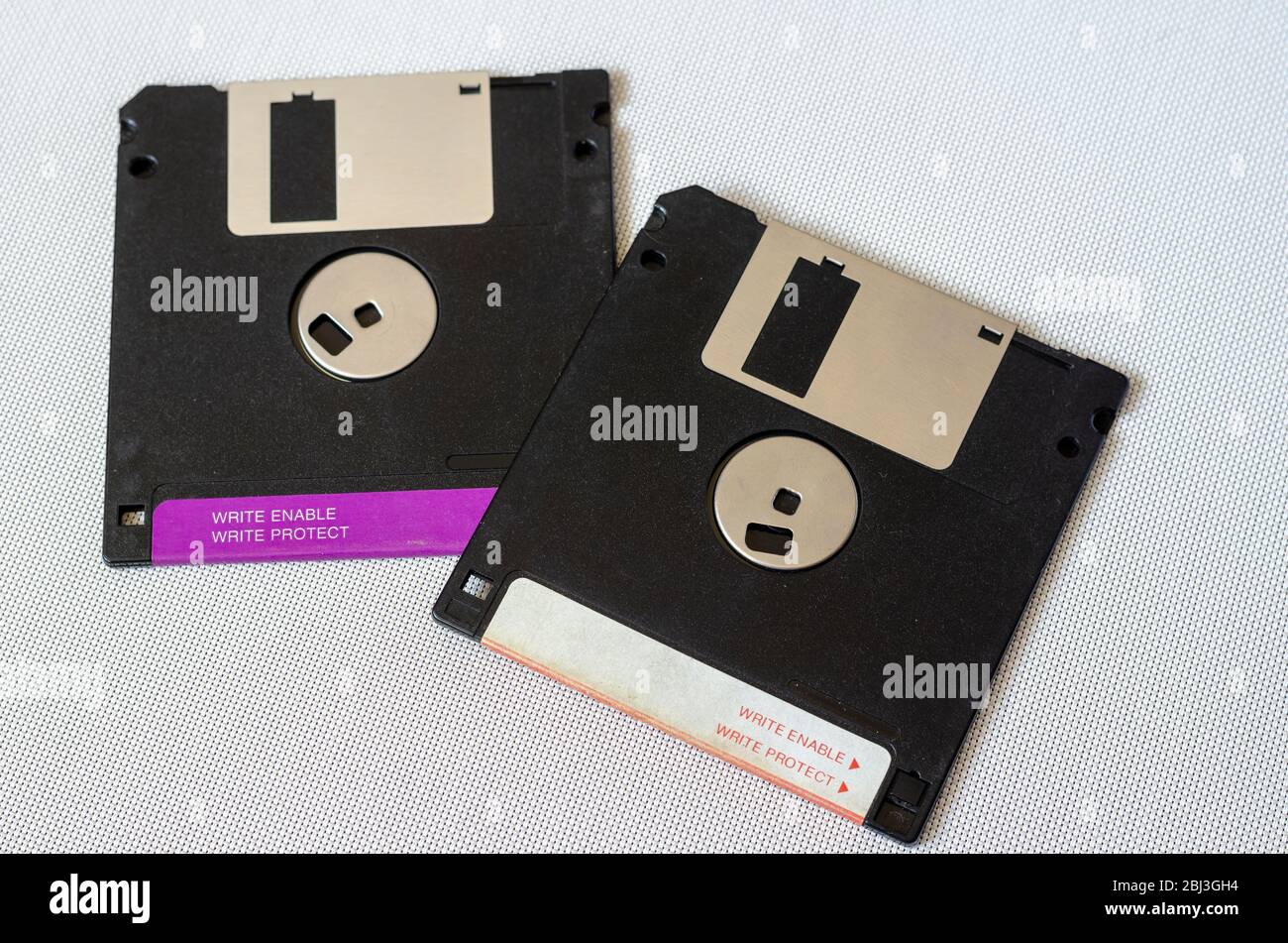 3.5 inch magnetic floppy disks. Two magnetic diskettes with a capacity of 1.44 MB. Obsolete digital data storage media. Close-up. Selective focus. Stock Photo