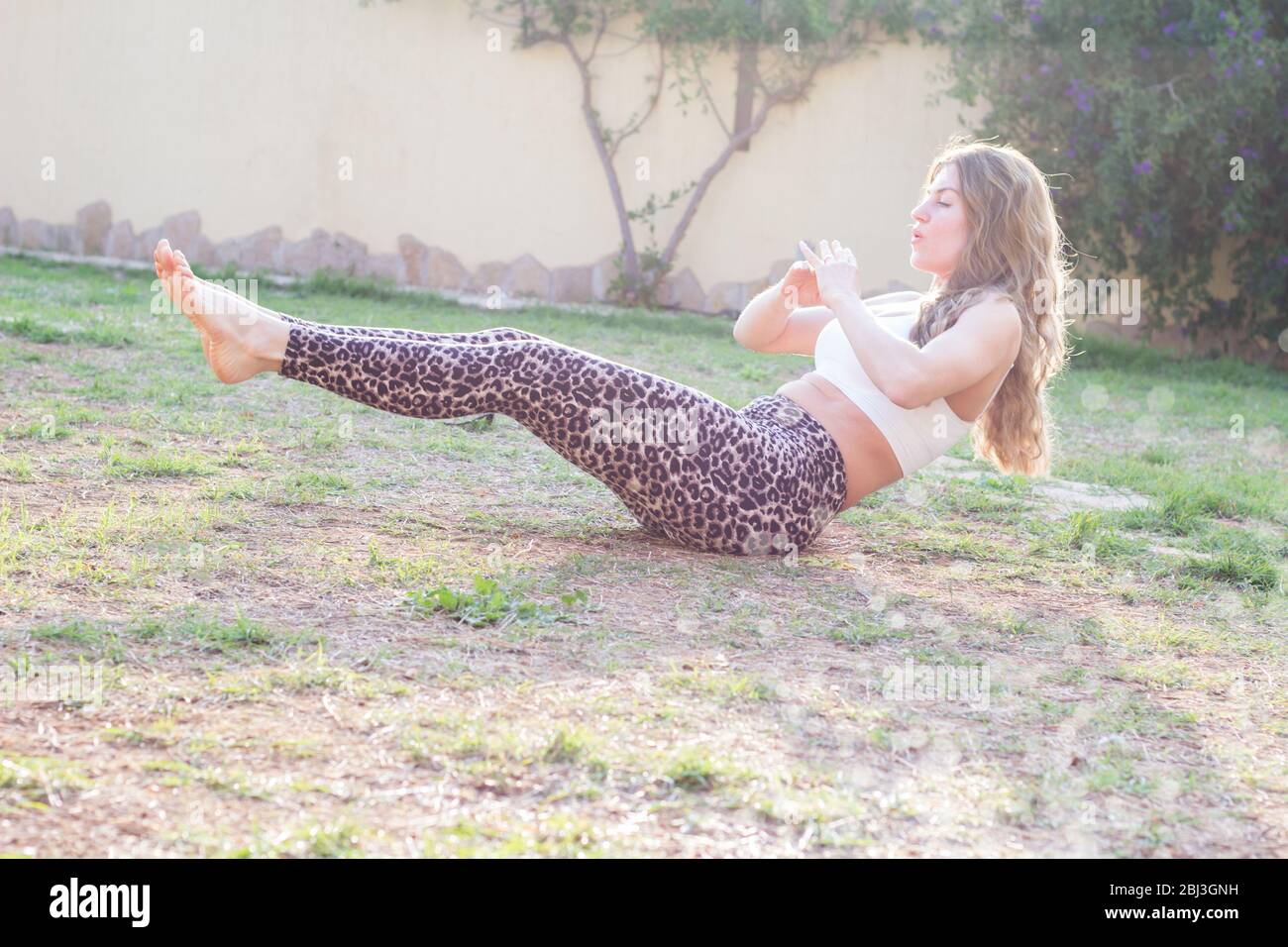 Young woman workout exercising outdoors Stock Photo