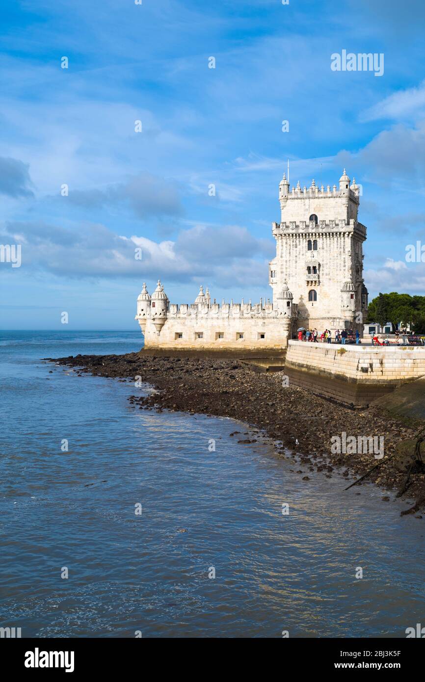 Tourists visit Belem Tower - the Tower of Saint Vincent is a 16th-century fortification and gateway to Lisbon, Portugal Stock Photo