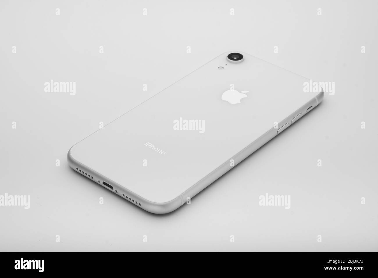 Moscow/Russia-1/4/20: The back side of iPhone XR in white color. iPhone XR is a smartphone designed and manufactured by Apple Inc. It is the twelfth g Stock Photo