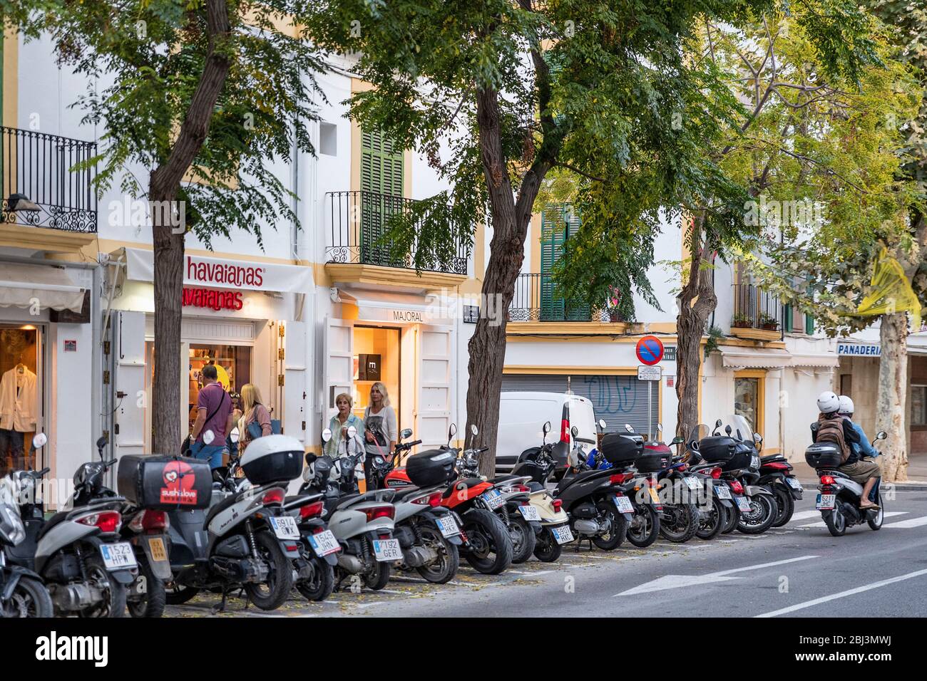 Scooters and shopsin Town on the Balearic Islands in Spain Stock Photo Alamy