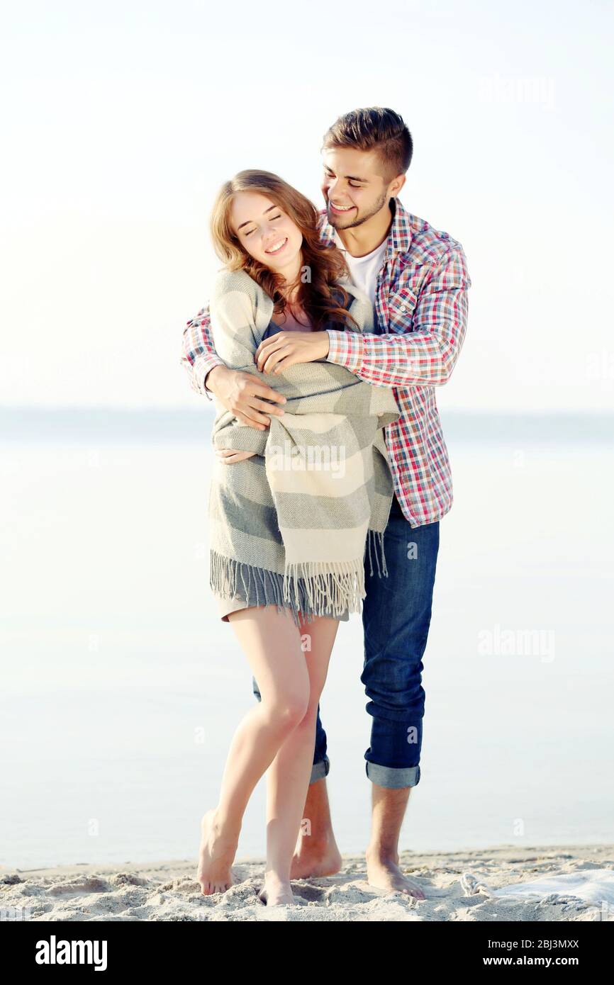 Young couple on the riverside Stock Photo - Alamy