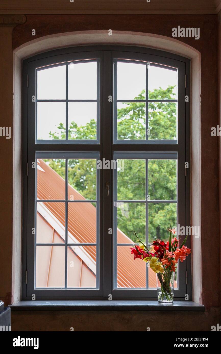Colourful flowers on an old window sill Stock Photo - Alamy