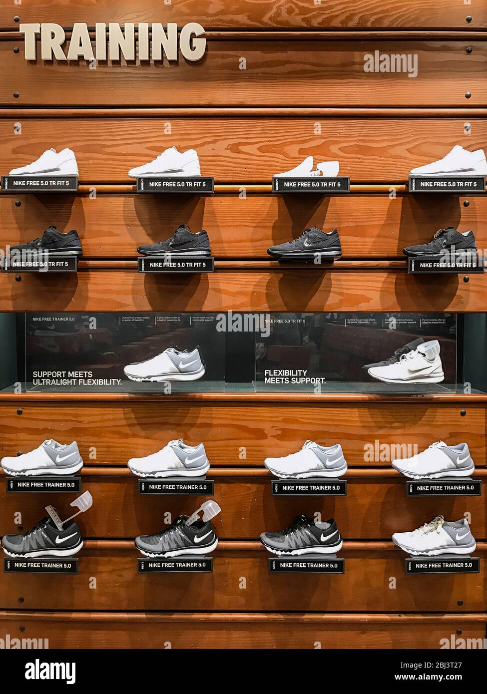 Nike training shoe display in a Nike store. Stock Photo