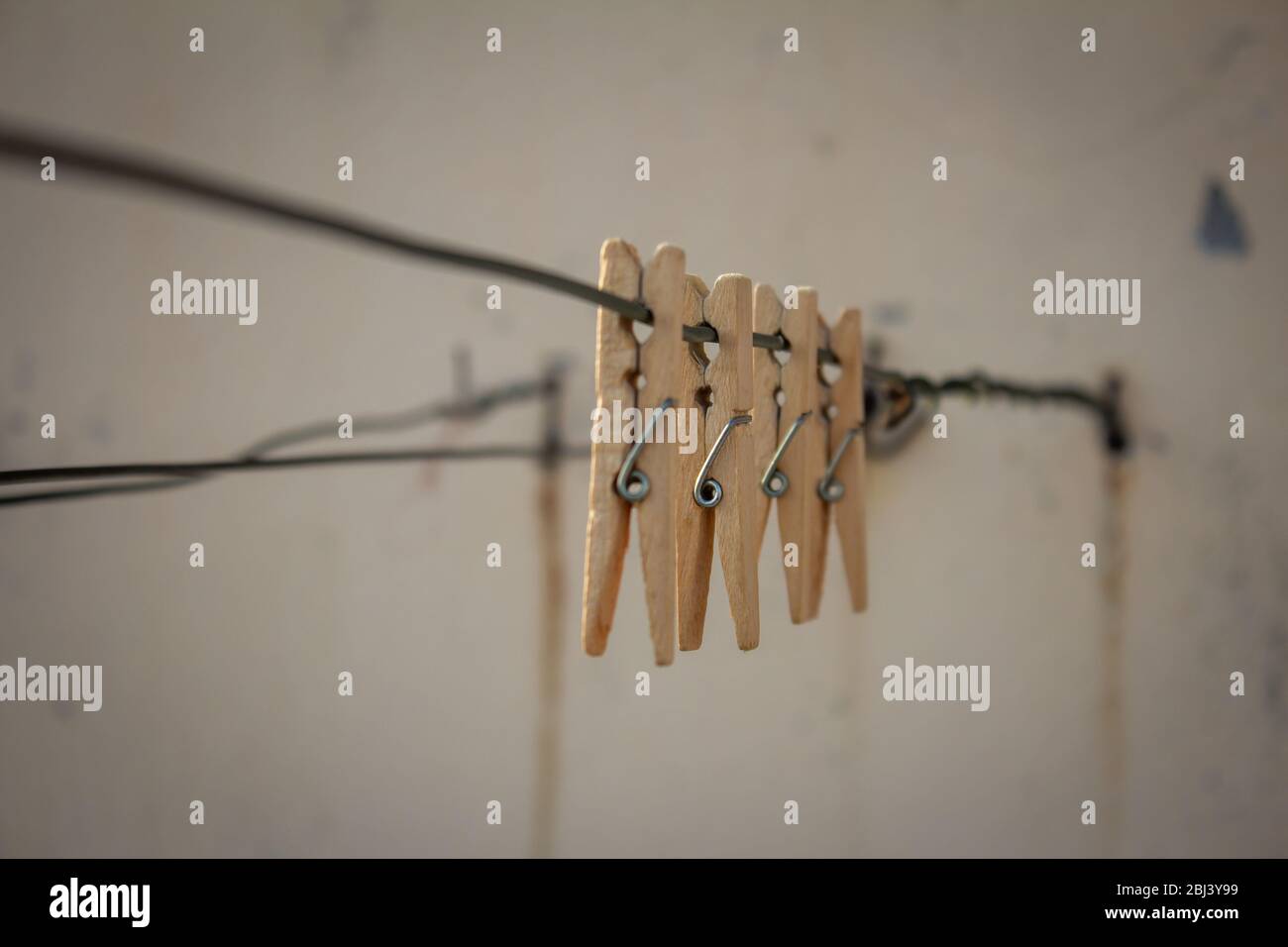 View of the wooden clips for holding clothes put for drying. Stock Photo