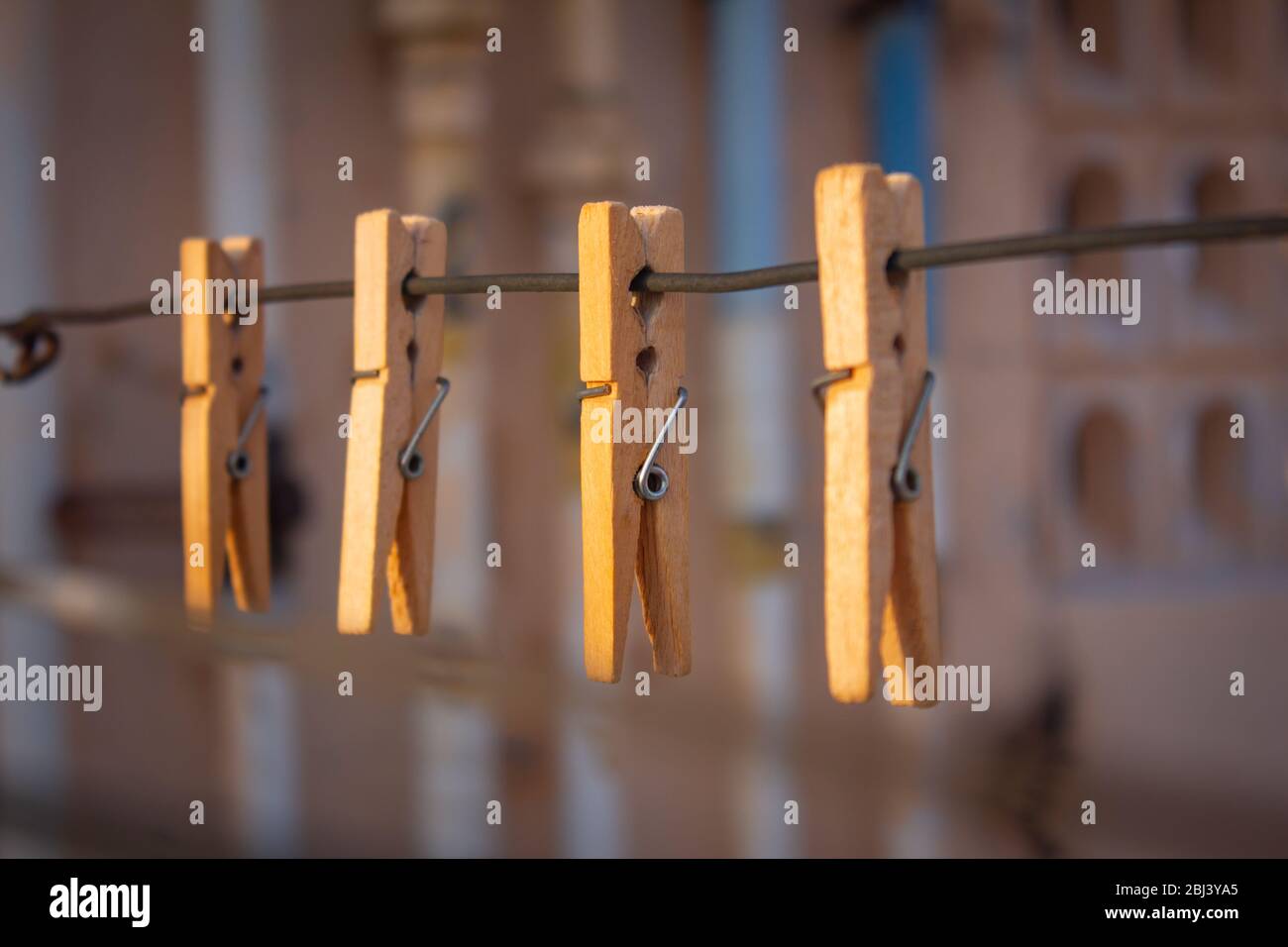 View of the wooden clips for holding clothes put for drying. Stock Photo