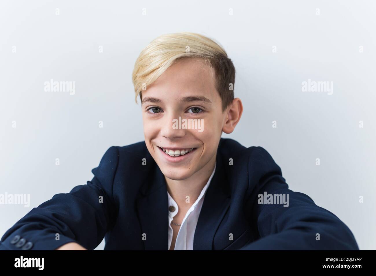 Attractive eleven year old boy with braces on his teeth. Dentistry and