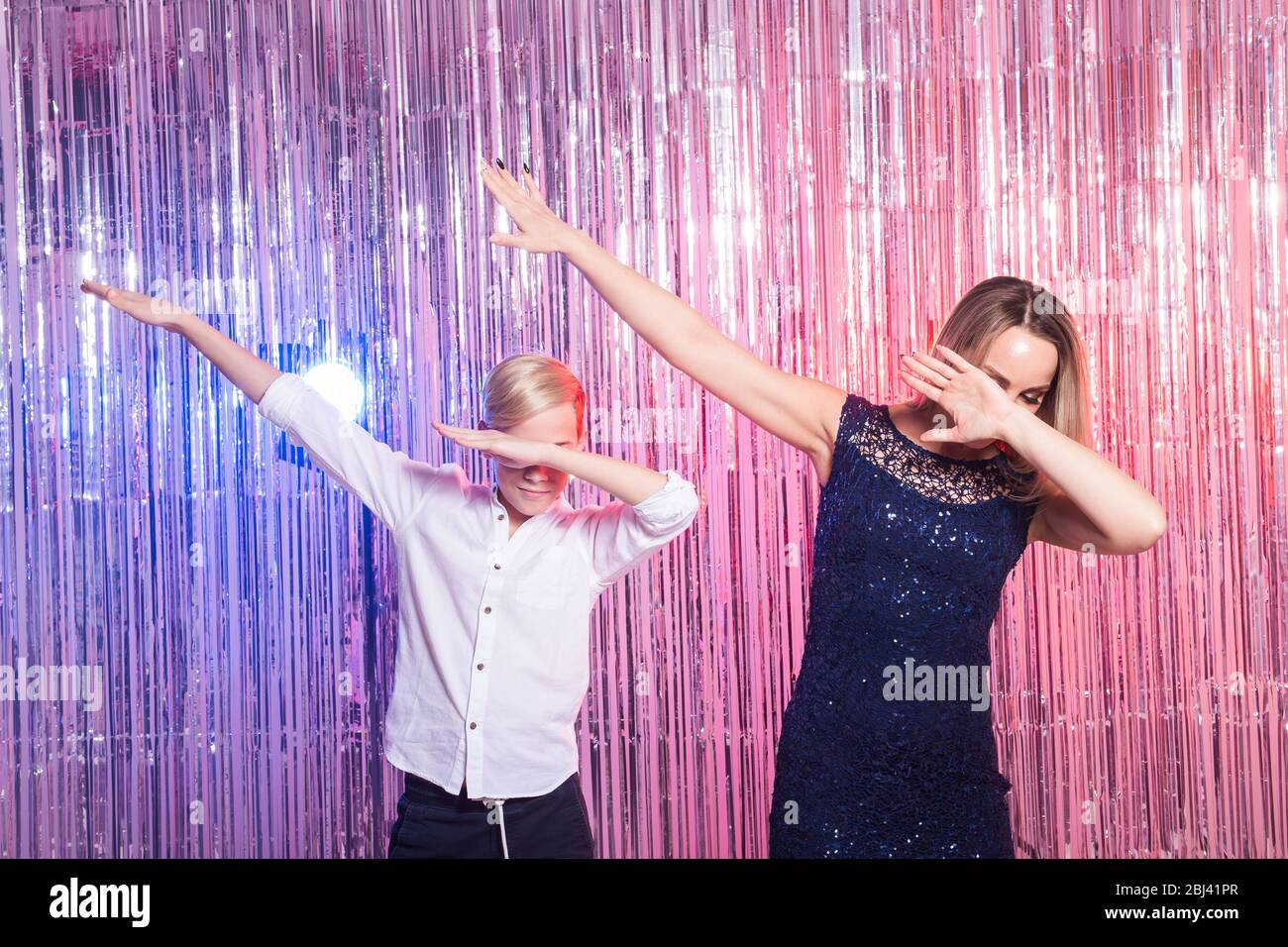 Fun, mothers day, children and family concept teen boy and his mom