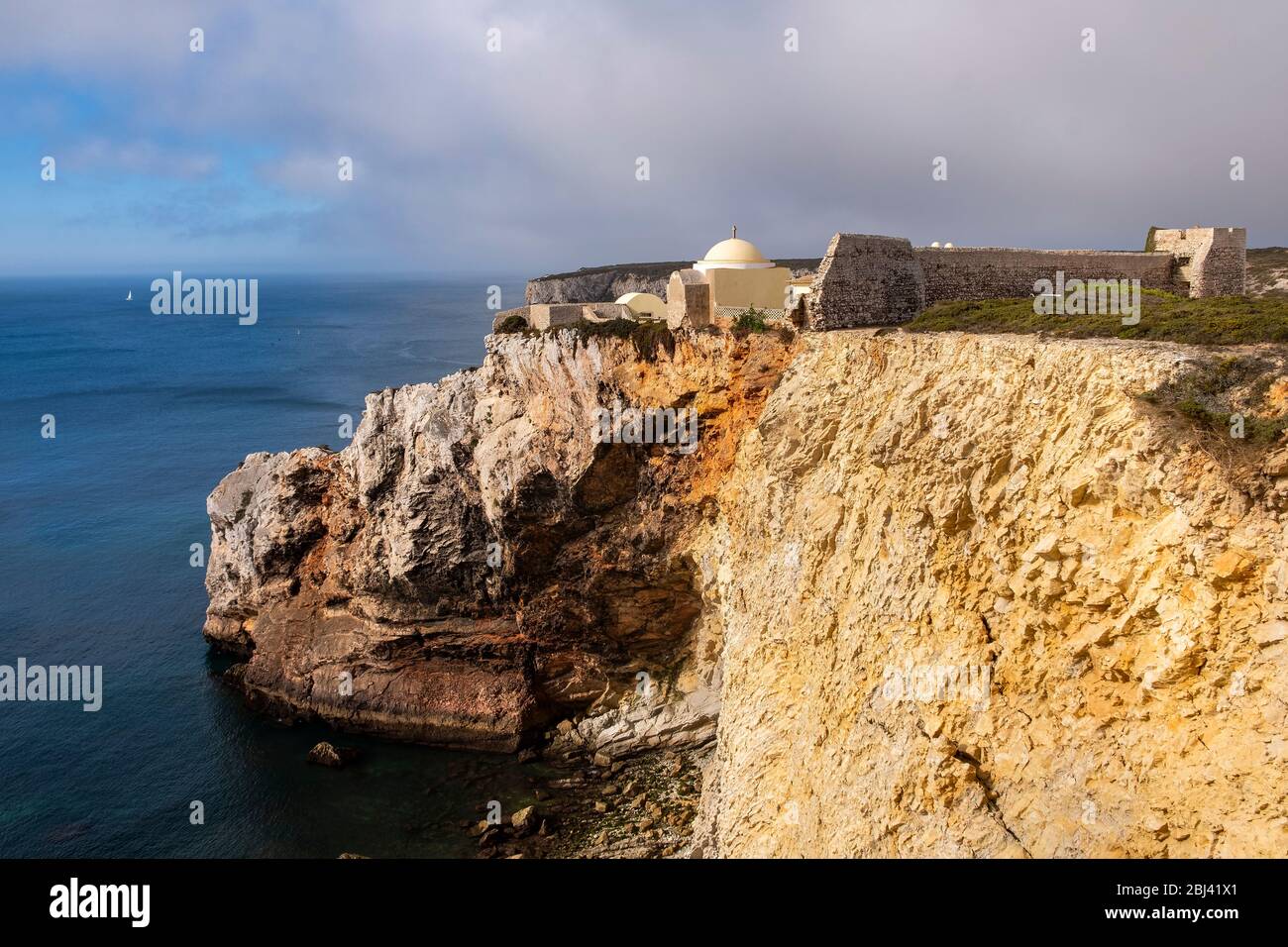 Fort of Santo António de Belixe and Cliff at Cabo de Sao Vincente. Solo Backpacker Trekking on the Rota Vicentina and Fishermen's Trail in Algarve, Po Stock Photo