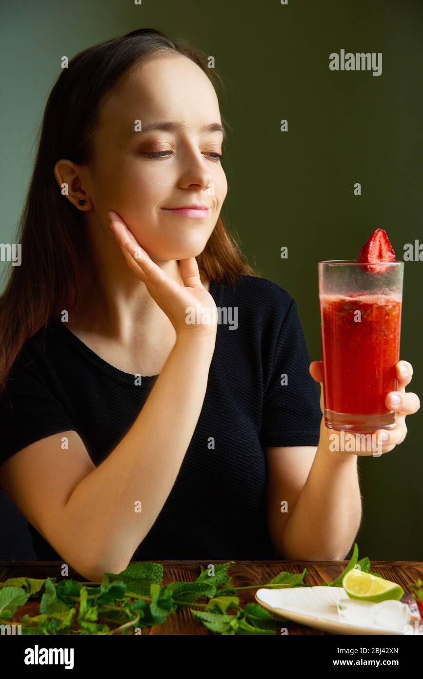 Cook at home cool summer cocktail with strawberries, lime and mint