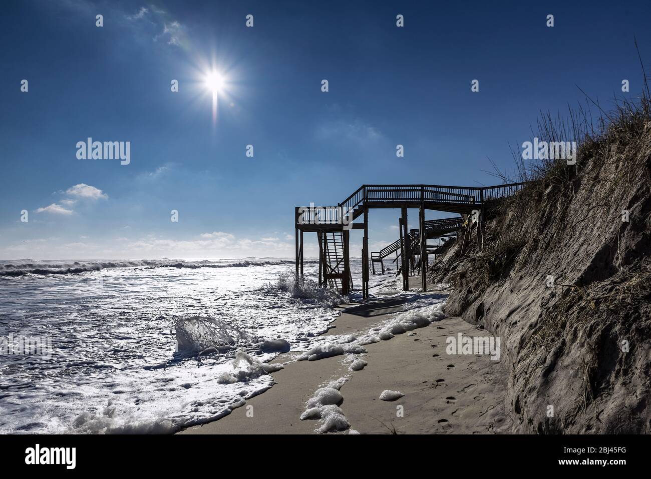 Beach steps surrounded by high tide surf in Nags Head on the Outer