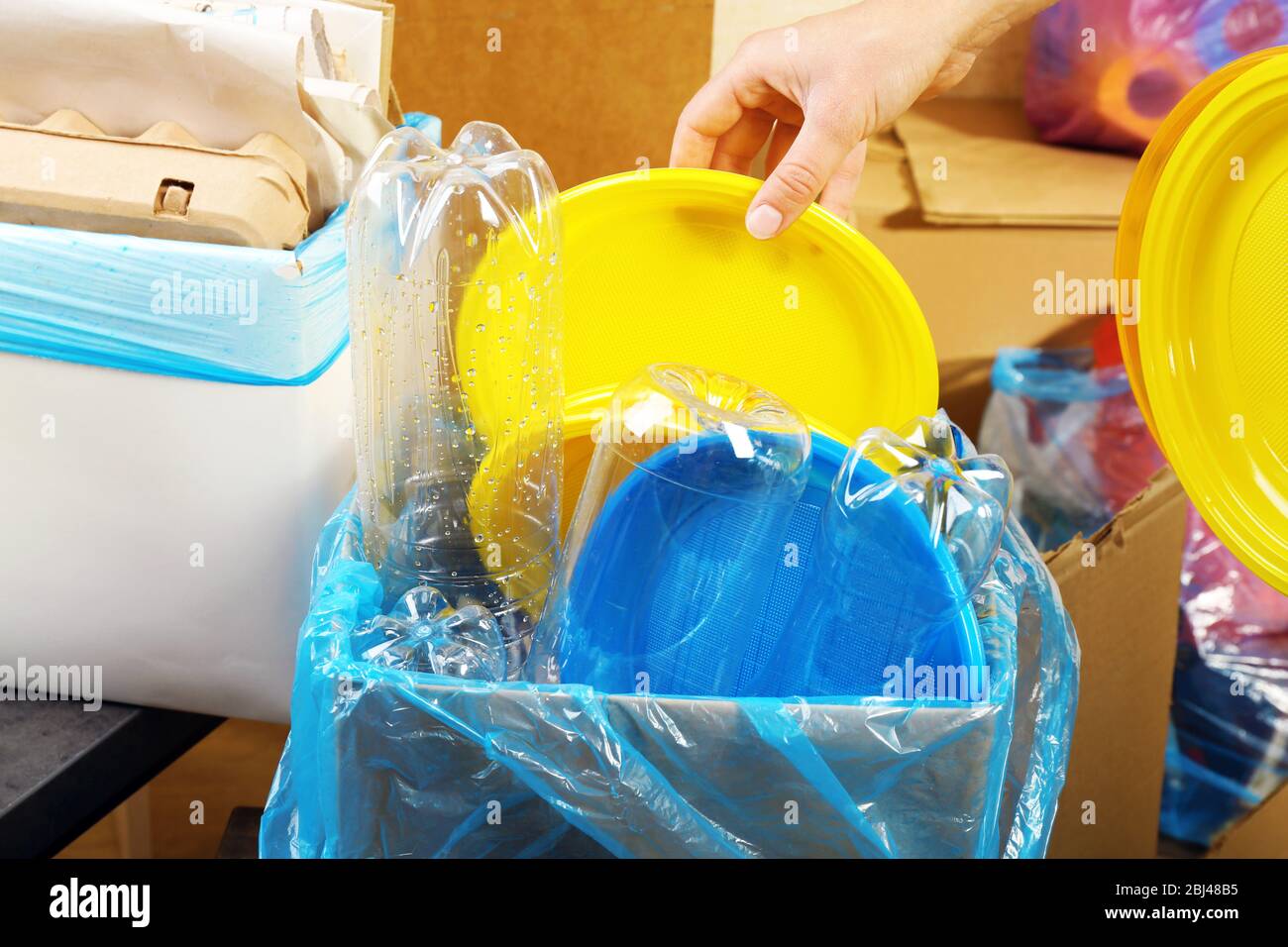 Woman sorting waste, close-up Stock Photo - Alamy