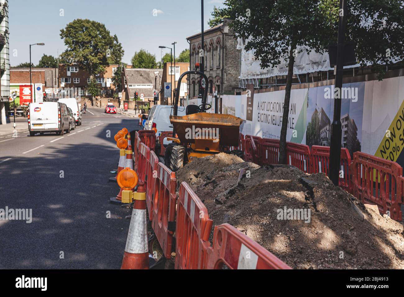 London/UK26/07/18safety cones fitted with flashing lights and a fence
