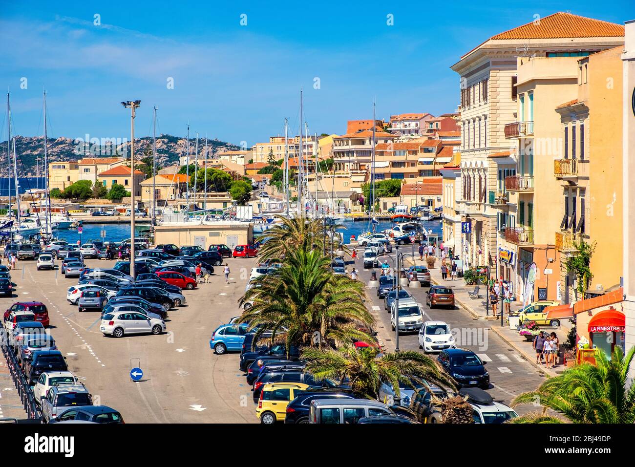 La Maddalena, Sardinia / Italy - 2019/07/17: Panoramic view of La Maddalena port quarter - Porto di Cala Gavetta - at the Via Amendola street Stock Photo