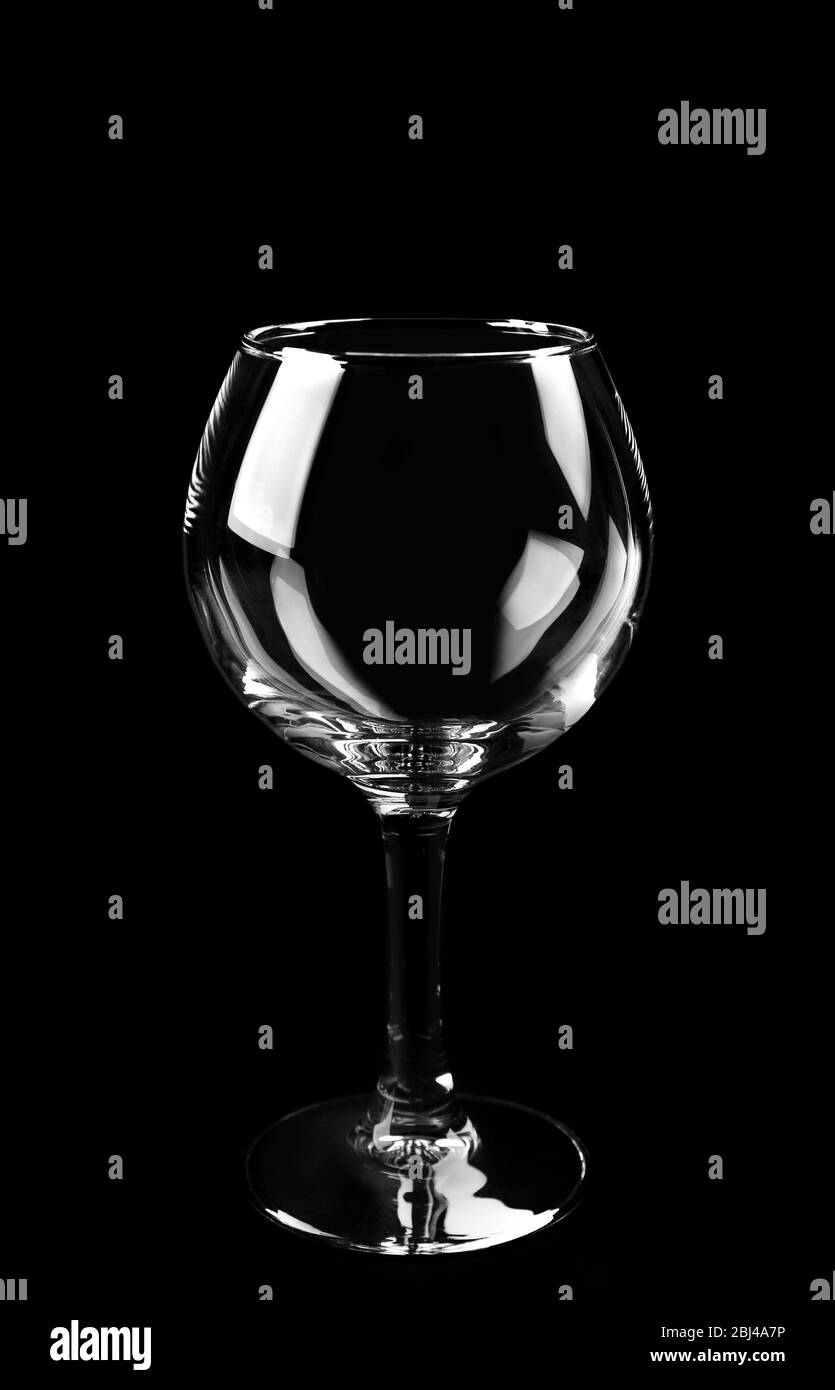 Empty glass on black background Stock Photo - Alamy