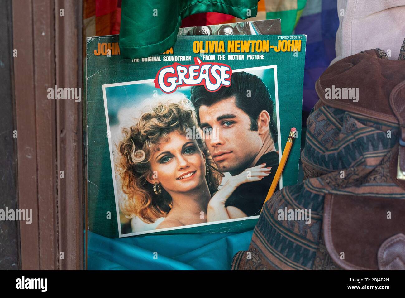 Used Grease movie soundtrack vinyl LP at vintage and secondhand store display window Stock Photo