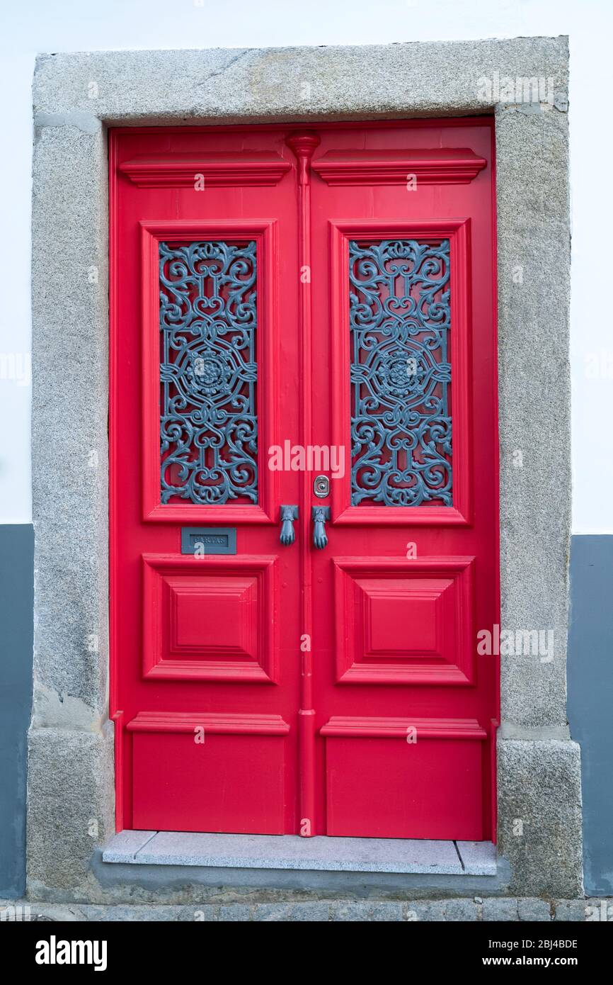 Typical front door with decorative metalwork in Evora, Portugal Stock Photo