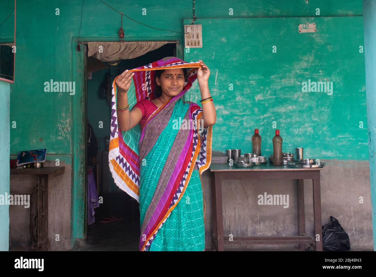 Indian woman holding a veil on her head Stock Photo
