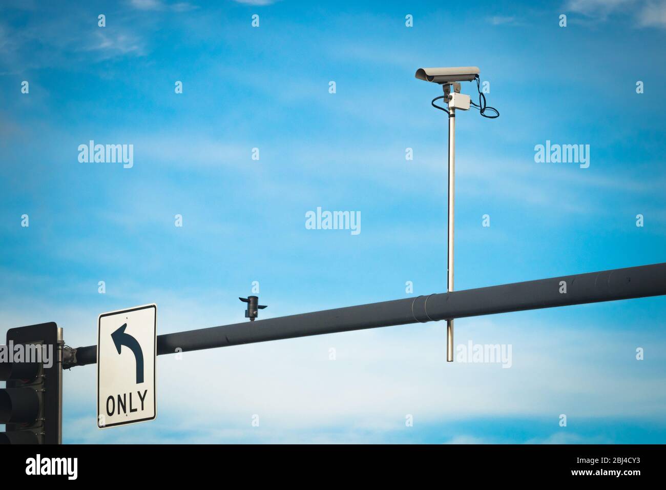 Traffic security camera mounted on intersection traffic light post ...