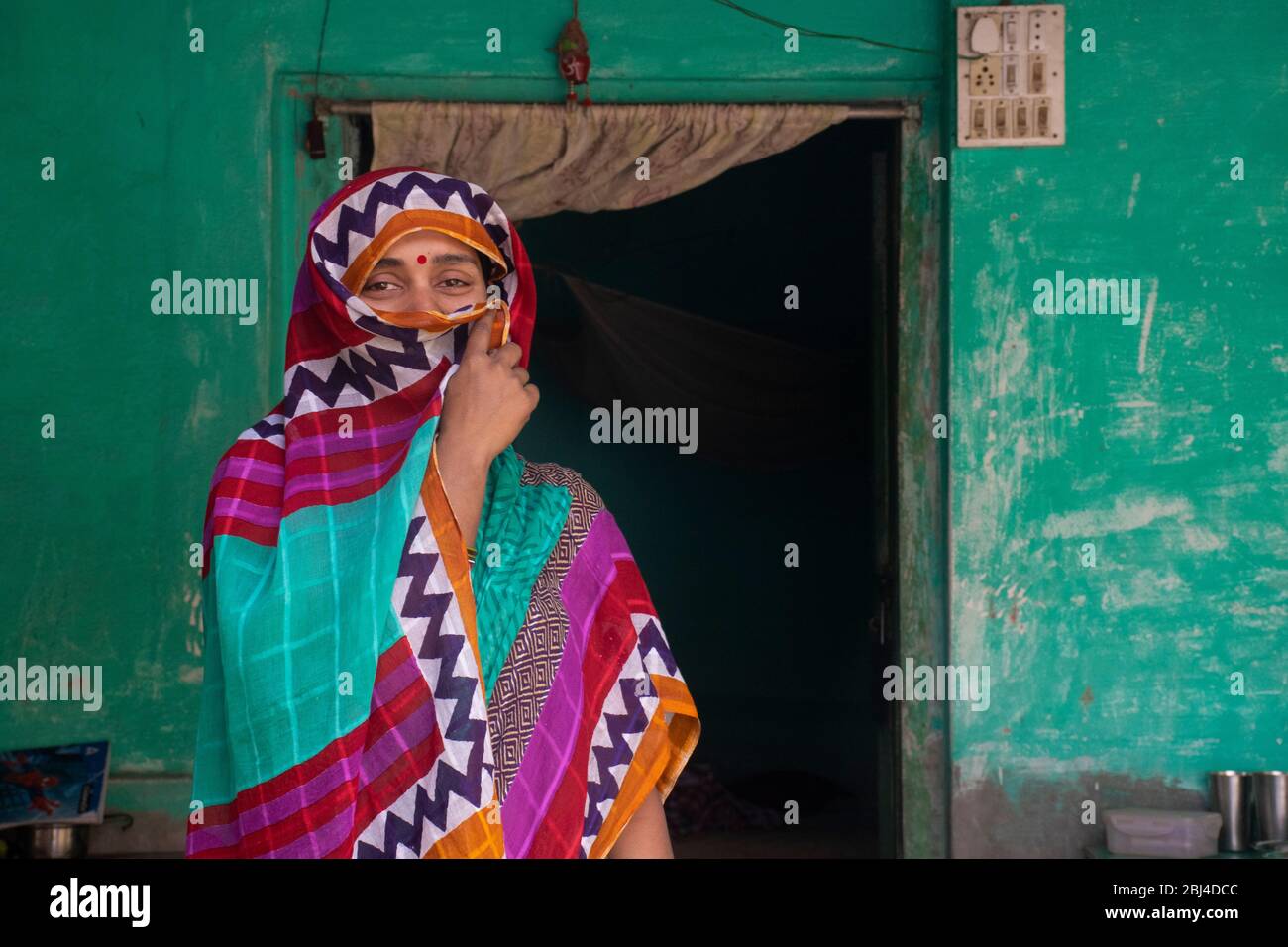 Indian woman holding a veil on her head Stock Photo