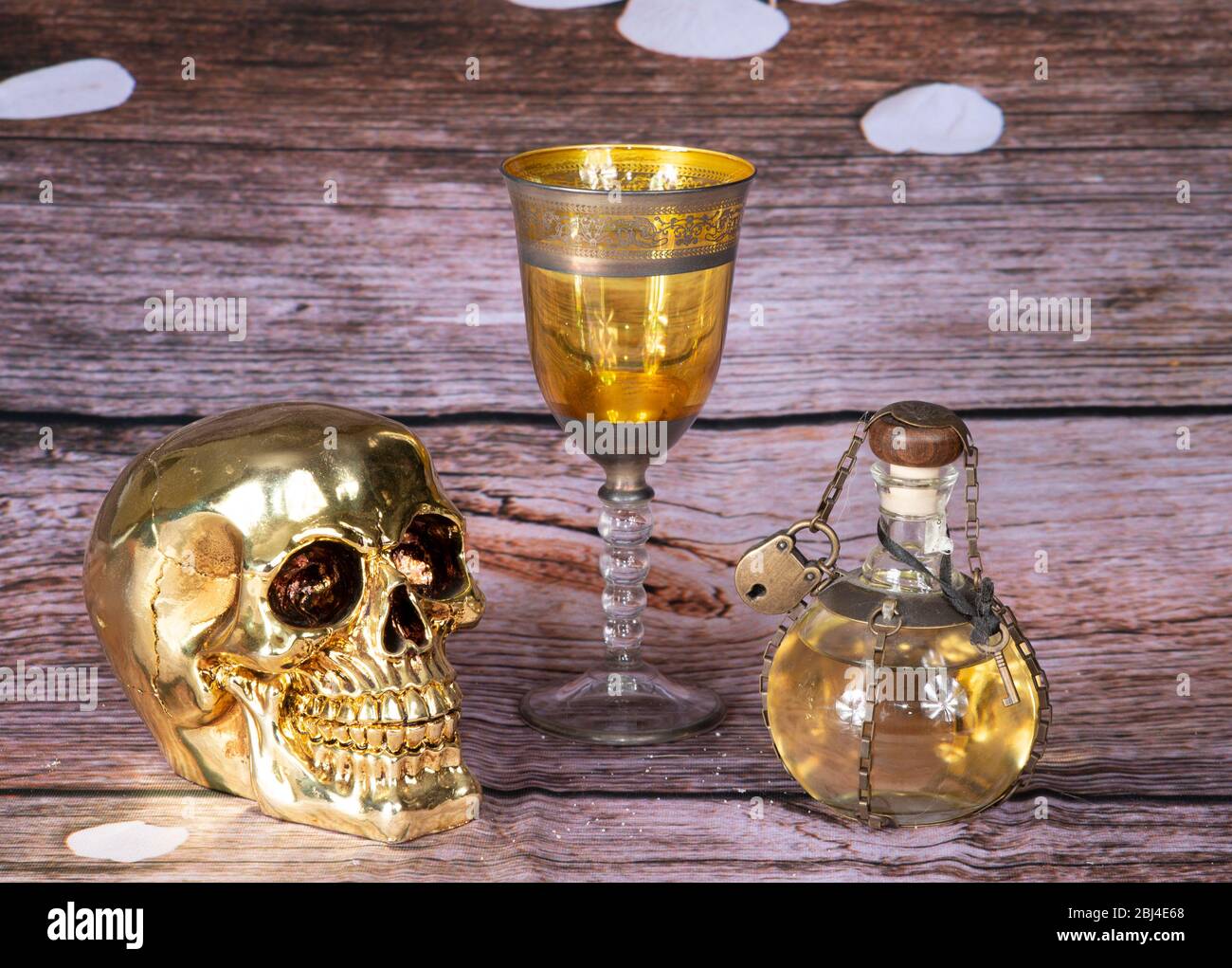 potion of love whit gold skull and glass medioeval Stock Photo