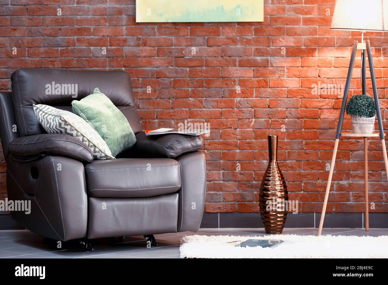 Modern living room interior with armchair and lamp Stock Photo - Alamy