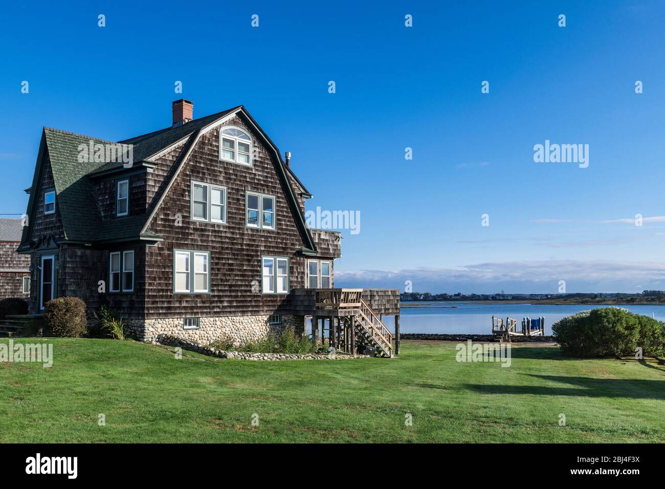 Charming waterfront beach house on Snug Harbour Stock Photo Alamy