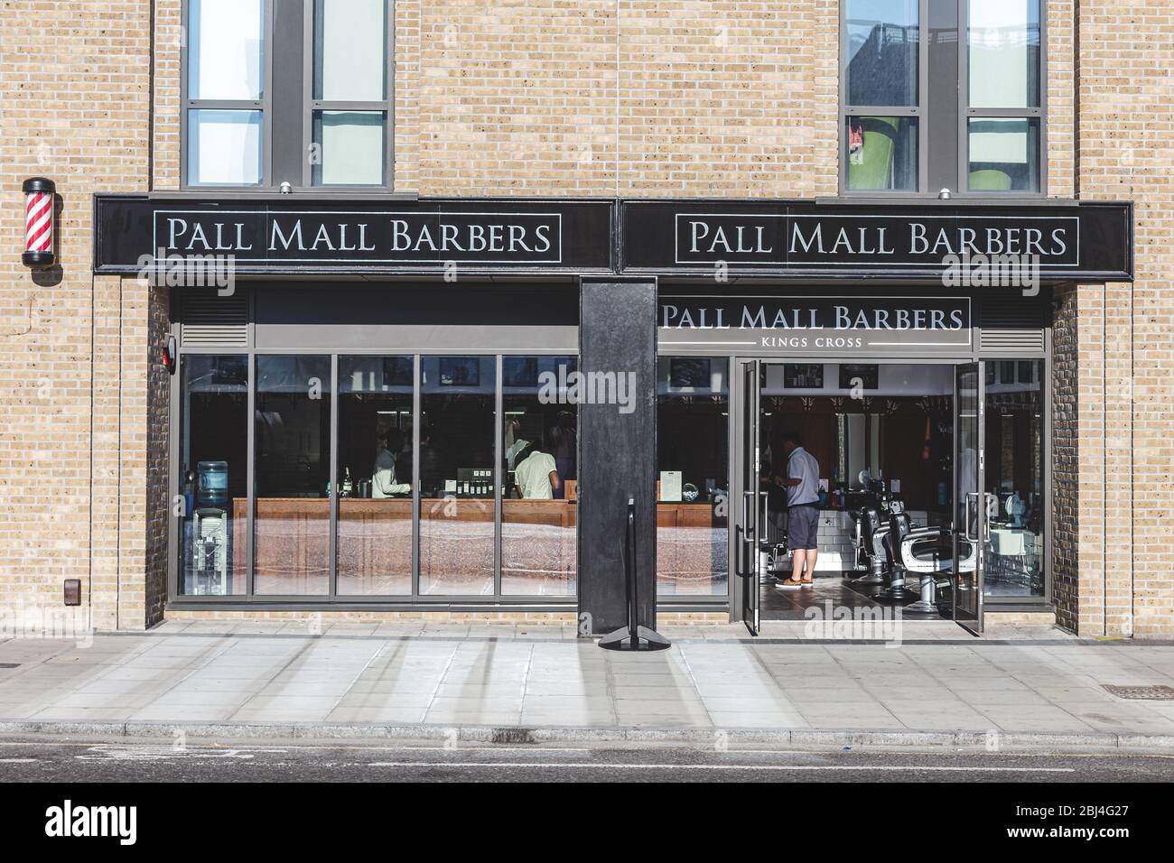 London/UK-26/07/18: Pall Mall Barbers in Kings Cross store, located right next to Kings Cross train and tube station on York Way. Barbershops are also Stock Photo