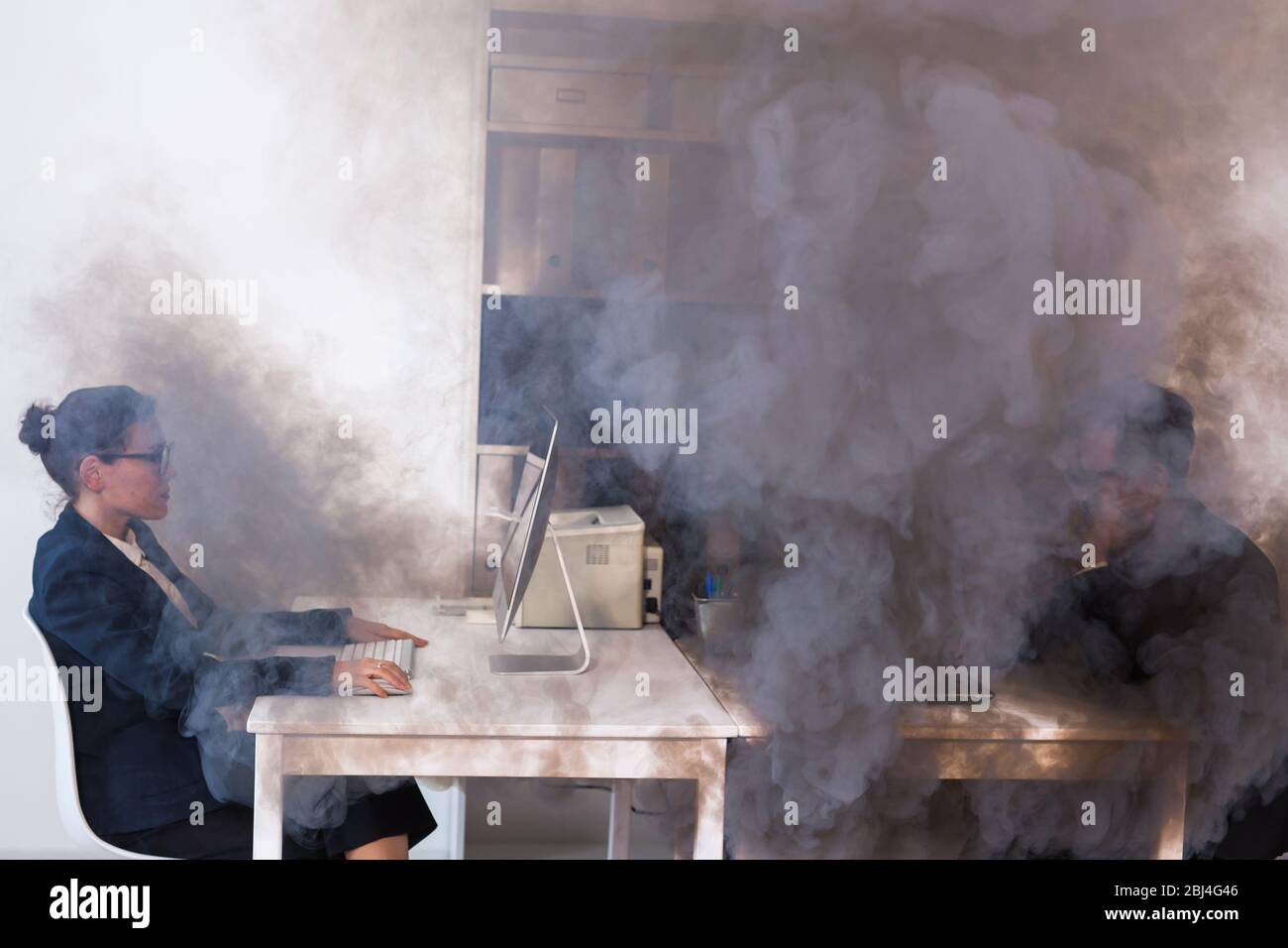 Close-up of fire burning inside the office cabin during works. Men and  women office workers in a fire. Short circuit and incidents concept. SOS  and Stock Photo - Alamy