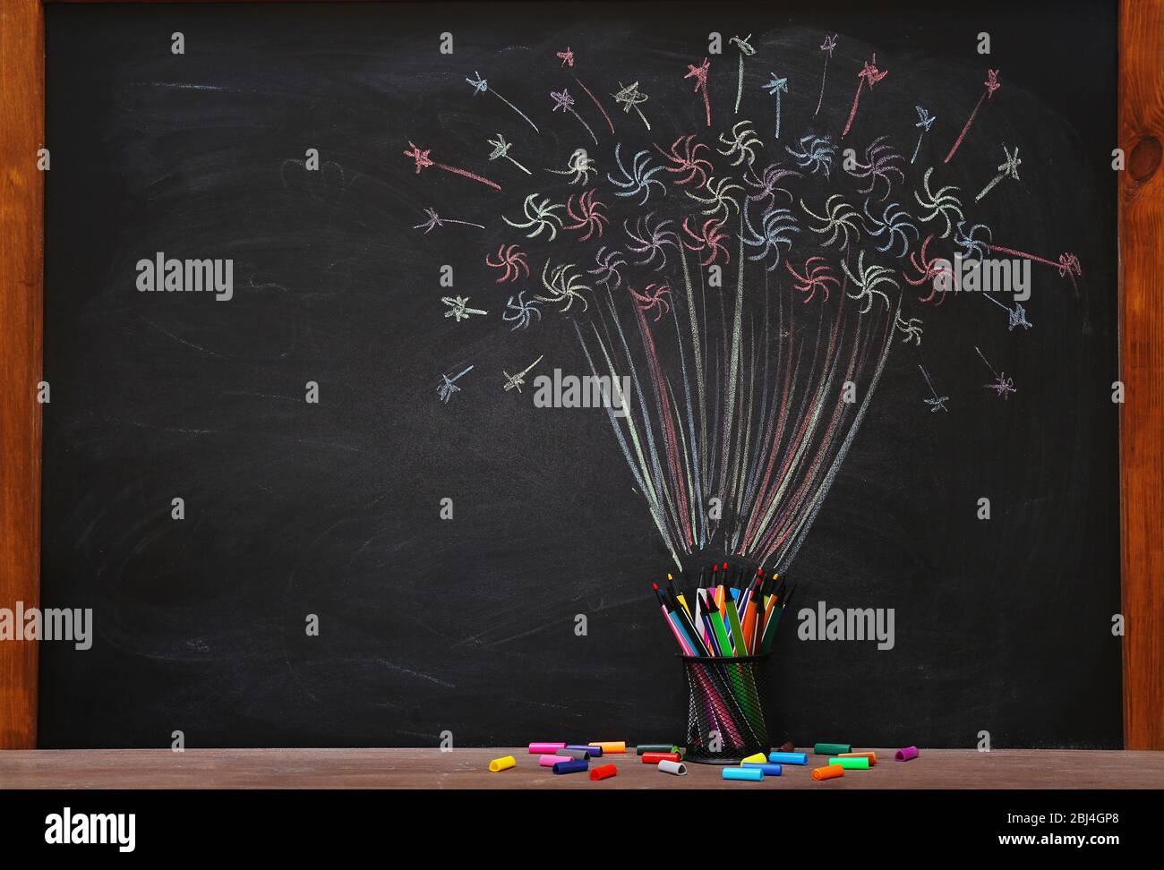Funny composition of office supplies and pictures drawn with chalk on