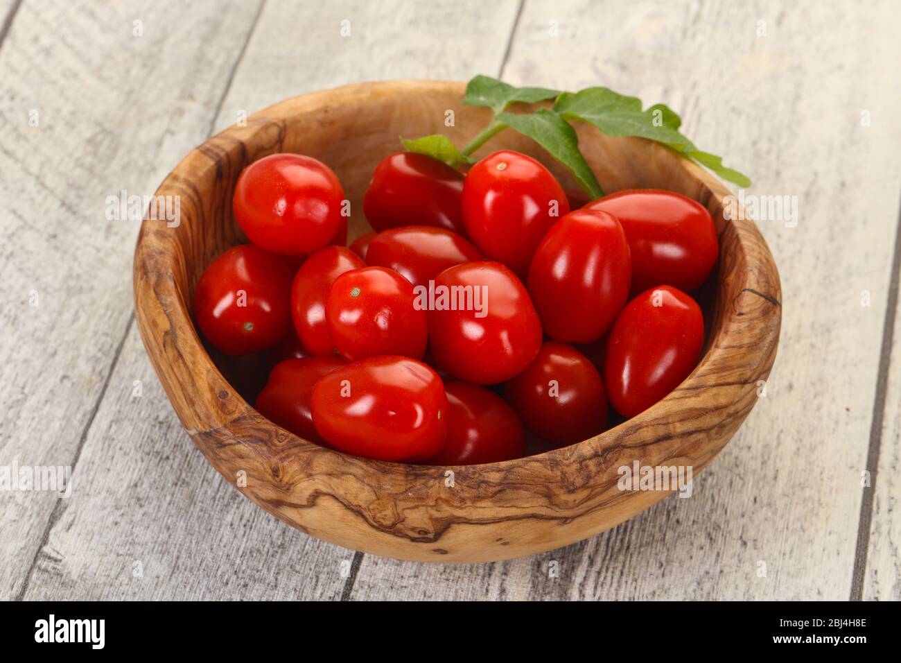 Sweet Red cherry tomatoes in the bowl Stock Photo - Alamy