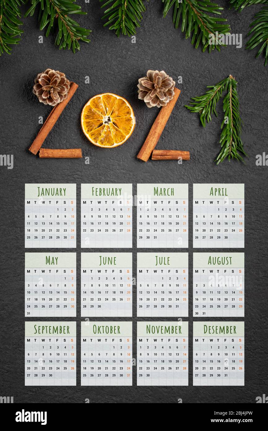 Eco friendly and zero waste pocket or advertising vertical calendar for 2021. Figures from natural materials, the week starts on Monday. Stock Photo