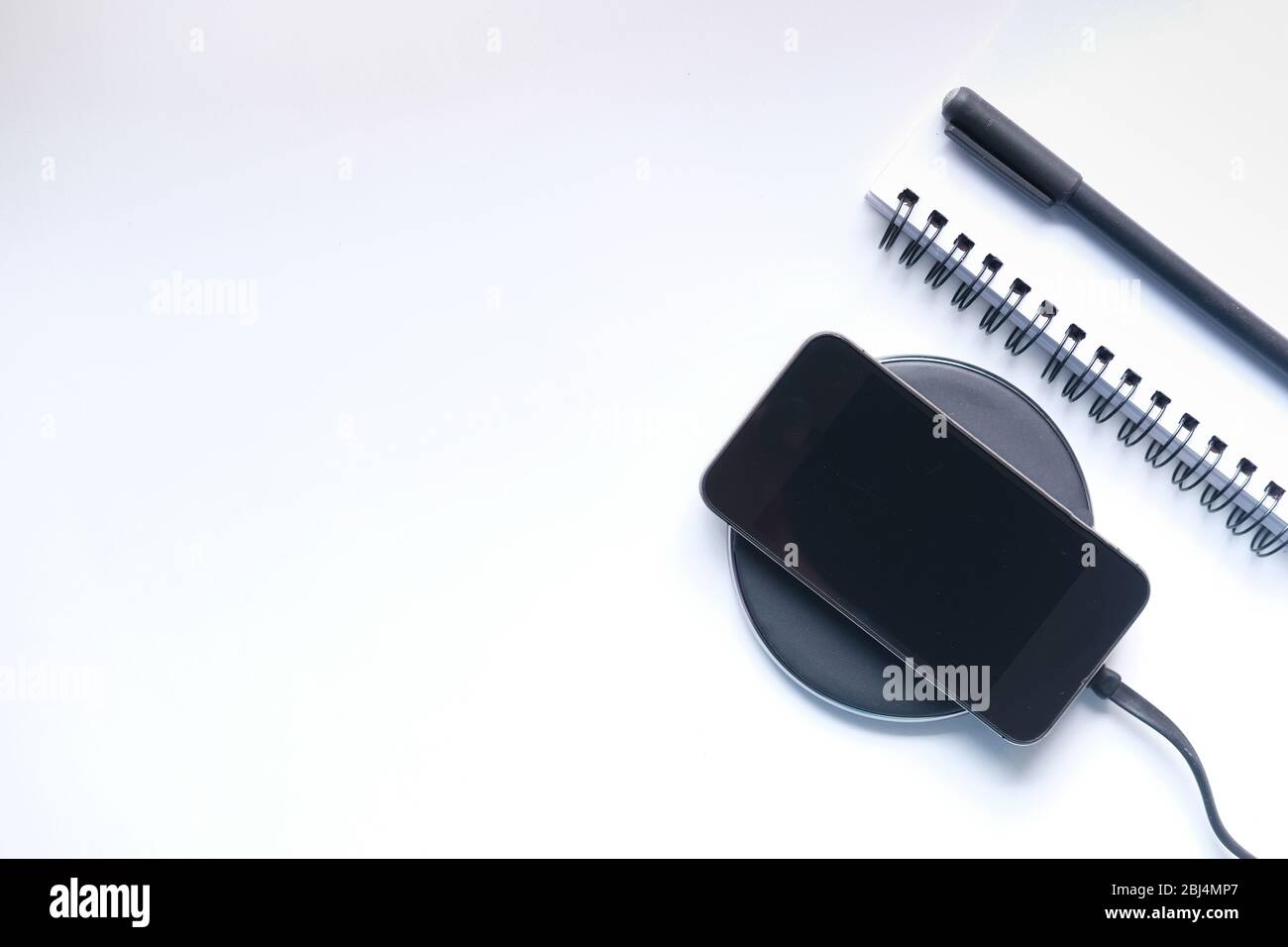 charging Smartphone Using Wireless Charging Pad Stock Photo Alamy