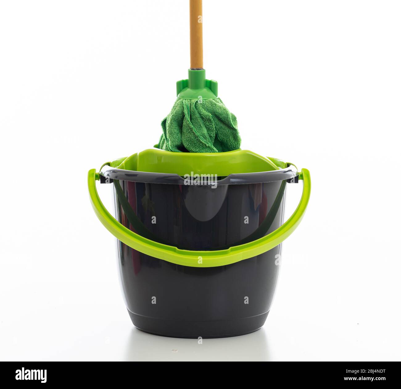 Bucket with dust wiper, sponges, chemicals bottles and mopping stick on the  floor in the apartment. Cleaning service concept Stock Photo - Alamy