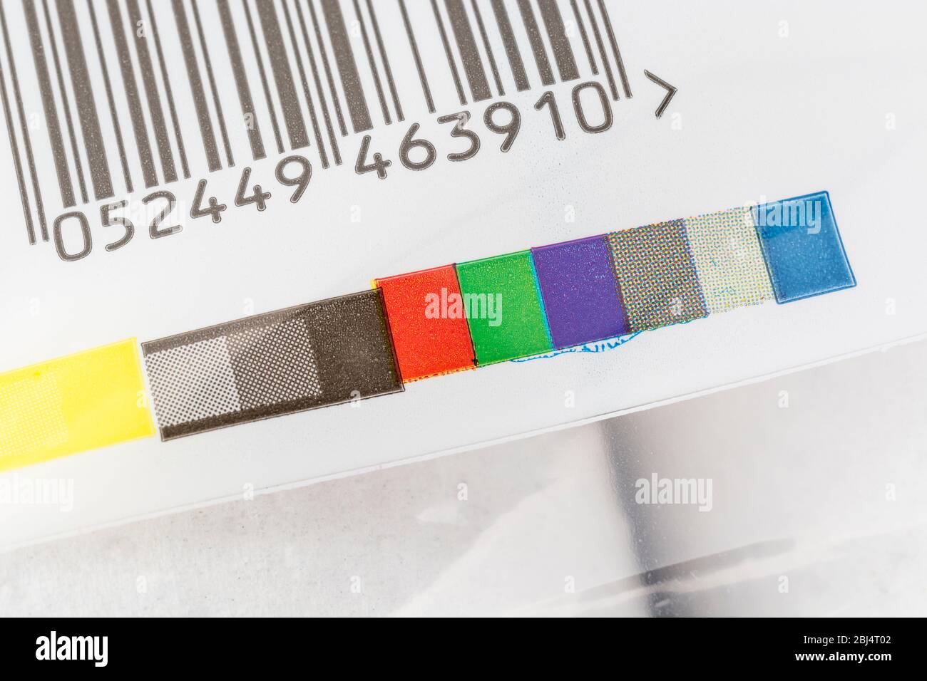 Colour registration strip on plastic packaging. For CMYK process colours, spot colours, printing registration, colours in industry, industrial process Stock Photo