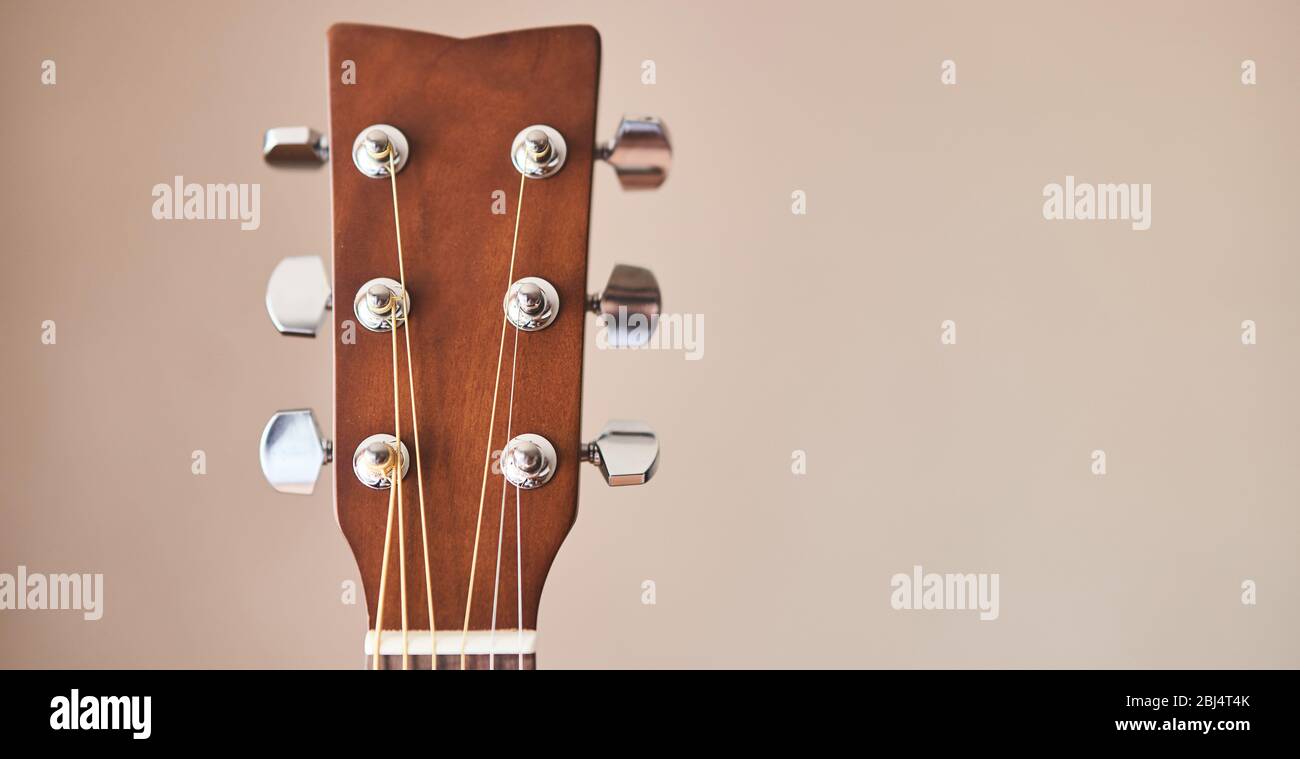 Acoustic guitar headboard with pegs. Guitar fretboard.  Stock Photo