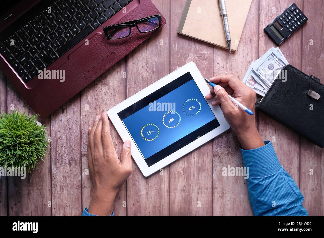 person hand analyzing financial data on digital tablet  Stock Photo