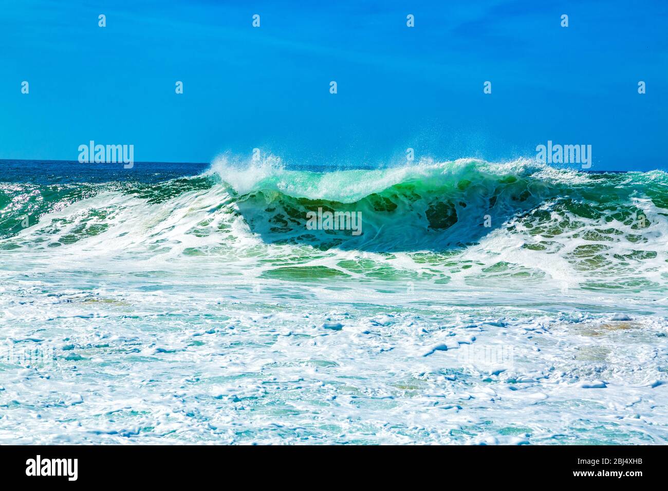 Big blue ocean waves with white foam Stock Photo