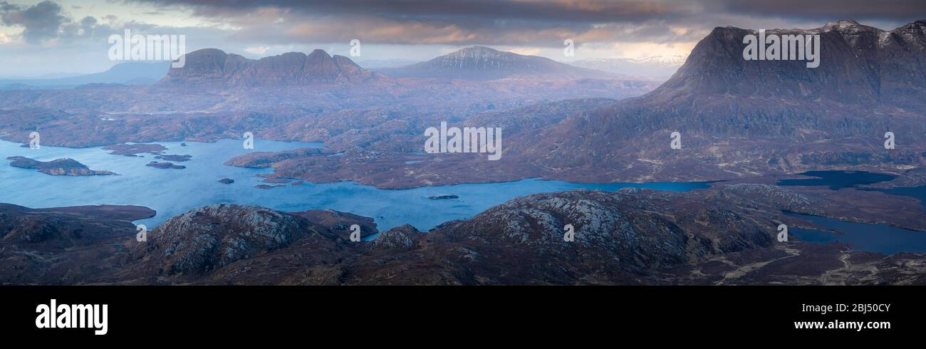 Looking out across Inverpolly from Stac Pollaidh as the evening light fades. Stock Photo