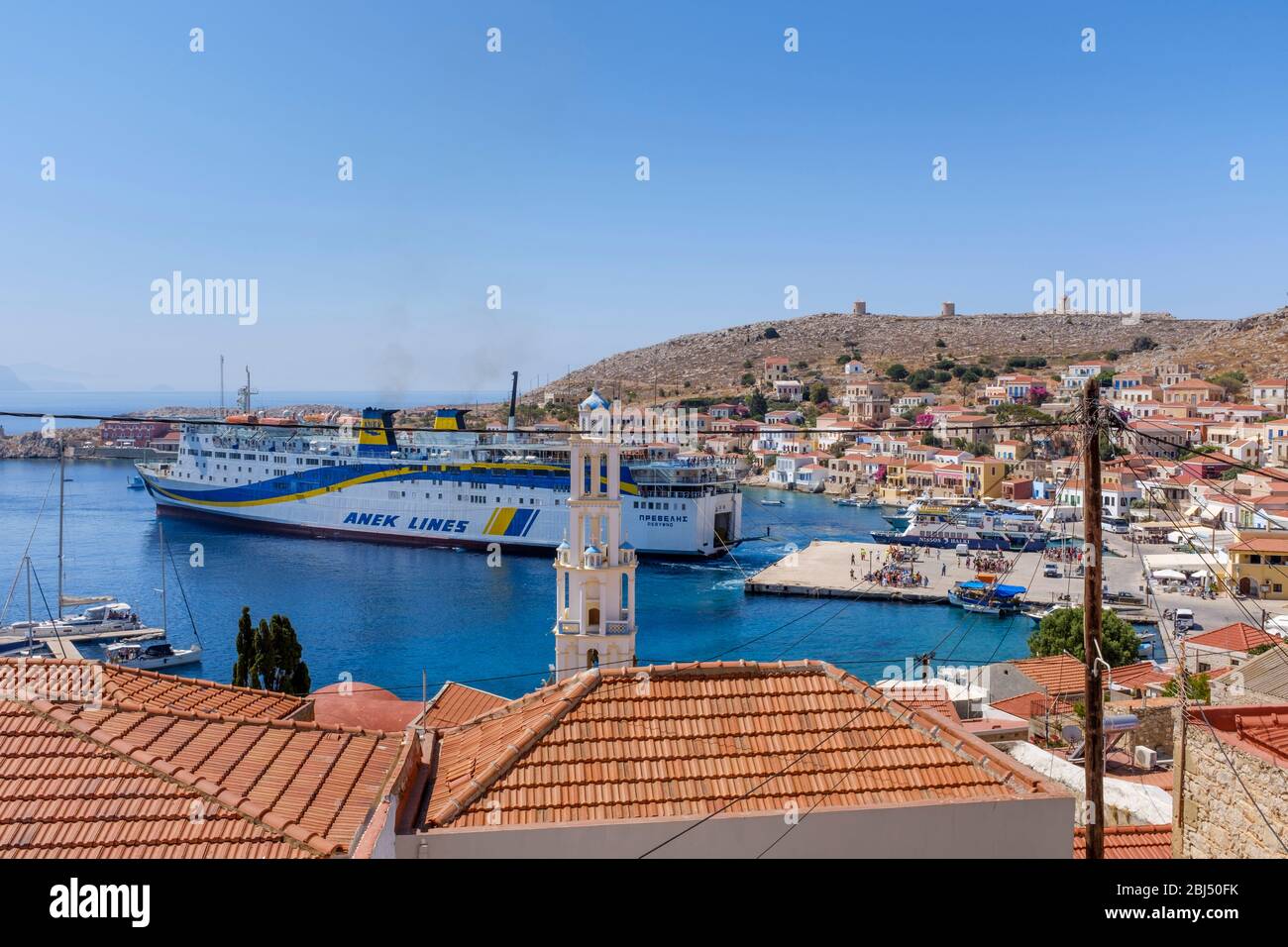 The Crete to Rhodes ferry docking at Halki. Stock Photo