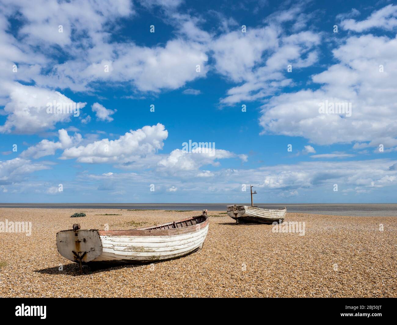 Small fishing boats on the beach at Aldeburgh. Stock Photo