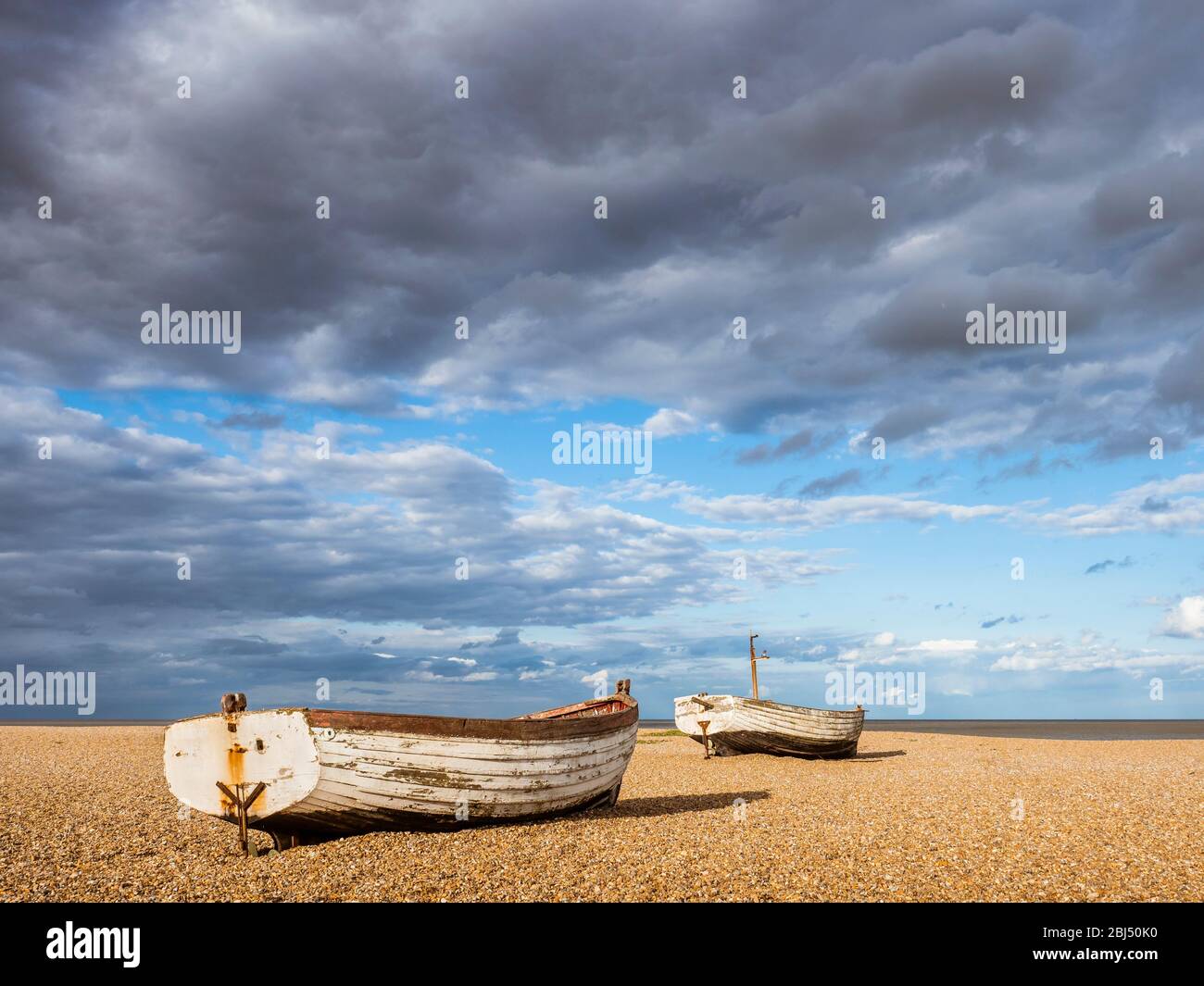 Small fishing boats on the beach at Aldeburgh. Stock Photo