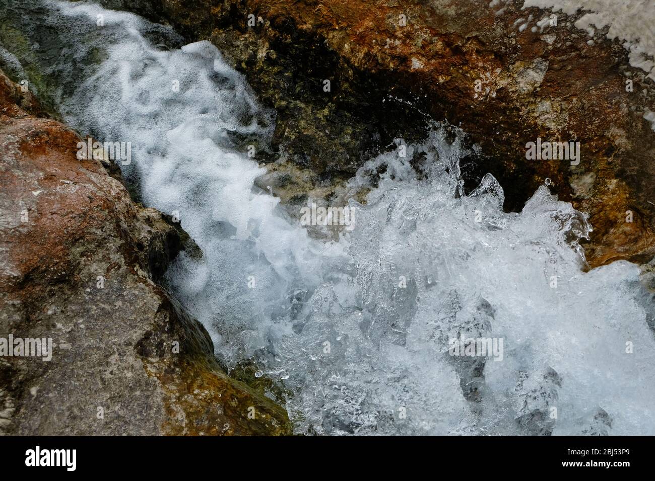 Water flowing from the stones Stock Photo - Alamy